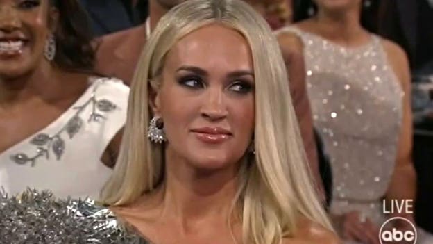 Carrie Underwood’s 'side-eye' reaction to Luke Bryan's 'immunized' joke goes viral