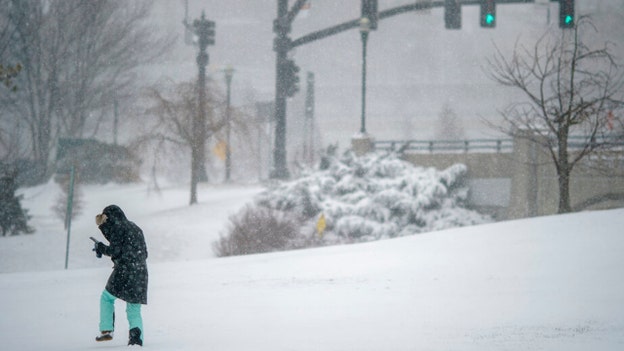 PHOTOS: Nor'easter blasts East Coast with heavy snow, high winds