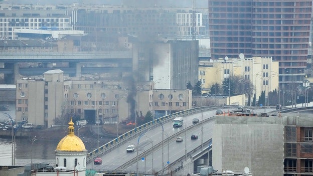 Smoke, flames rise near military building in capital Kyiv