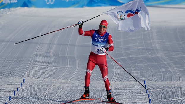 Russian skier wins gold in 30K skiathlon