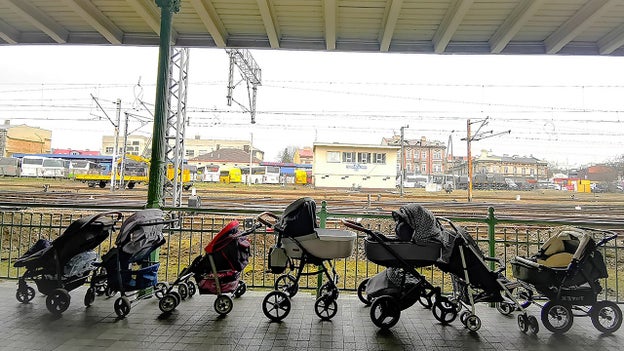 As Ukraine's moms flee to Poland amid war, they're greeted by gifts of baby strollers