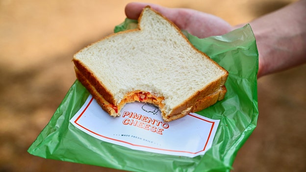 Pimento cheese sandwiches, public phones and lush greens mark golf’s premier event