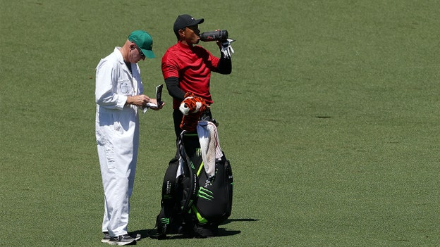 Woods finishes up and down front nine with three straight pars