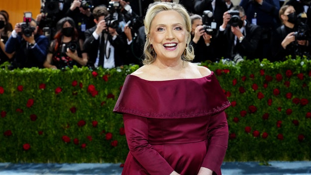 Hillary Clinton spry in burgundy dress at 2022 Met Gala