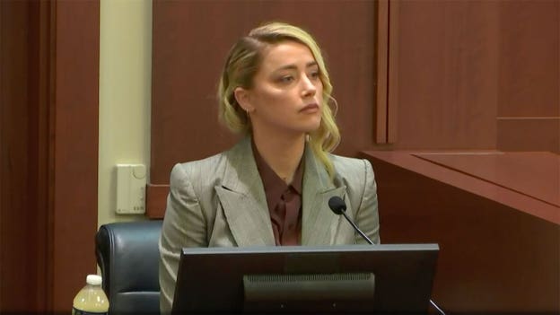 'People want to kill my baby in the microwave,' Amber Heard tells jurors