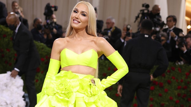Gwen Stefani brightens up 2022 Met Gala in ‘guilded’ neon dress