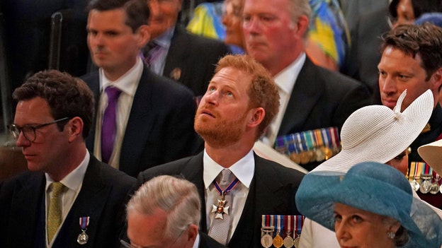 A nervous Prince Harry takes his seat