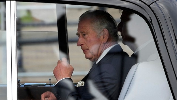 King Charles III arrives at Buckingham Palace ahead of Queen Elizabeth II's coffin procession