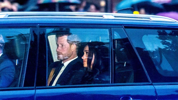 Prince Harry and Meghan Markle join royal family at Buckingham Palace to receive queen's coffin