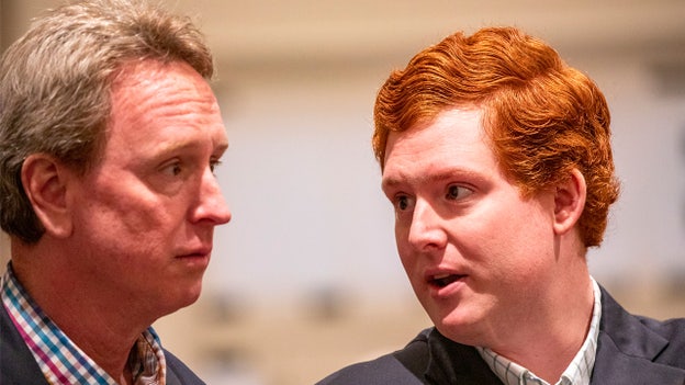 John Marvin Murdaugh and Buster Murdaugh enter the courtroom shortly before jury is due to return