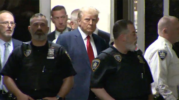 Trump being arraigned in NYC courtroom after processing