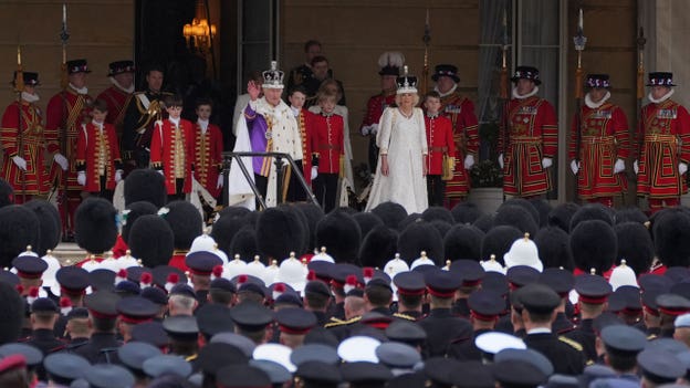 King Charles III arrives at Buckingham Palace after coronation ceremony for royal salute