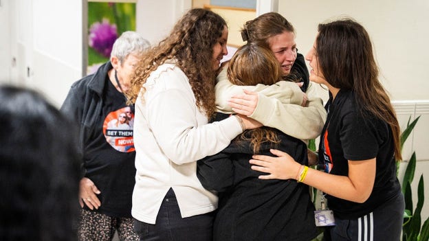 Israel releases photos of freed hostages embracing their loved ones