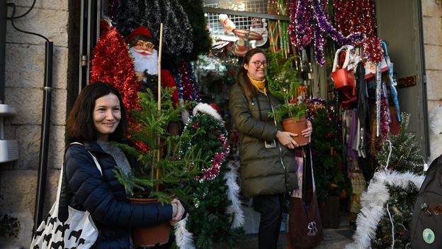 Jerusalem holds annual Christmas tree distribution as war rages in Gaza