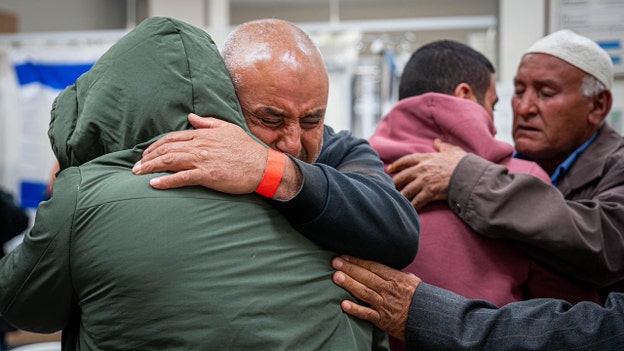 Israeli hostages embrace family members in emotional reunion