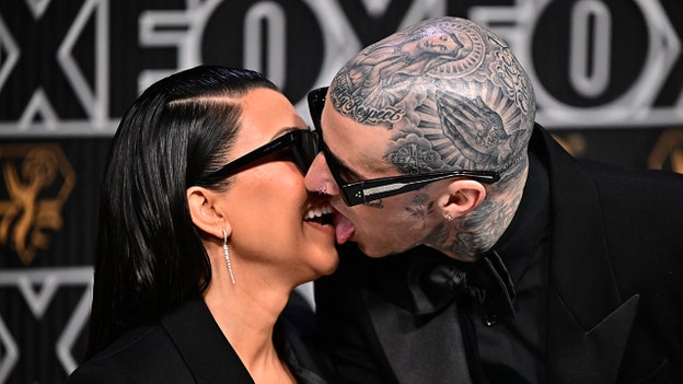 Kourtney Kardashian and Travis Barker make out on Emmys red carpet