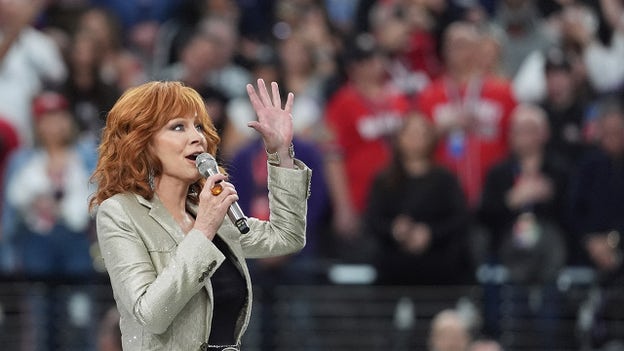 Country music star Reba McEntire performs the national anthem