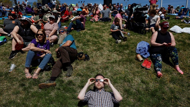 People gather at Saluki Stadium in Illinois ahead of a total solar eclipse