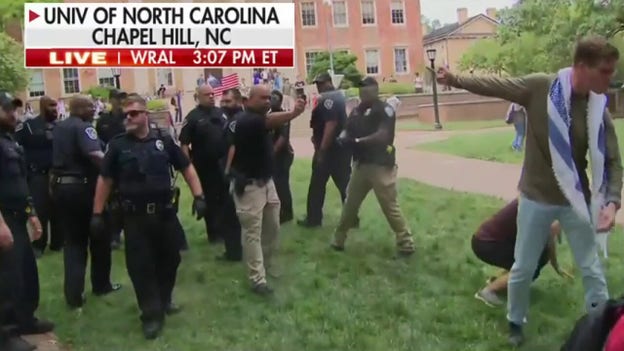 Police deploy pepper spray on protesters at UNC Chapel Hill; protesters replace American flag