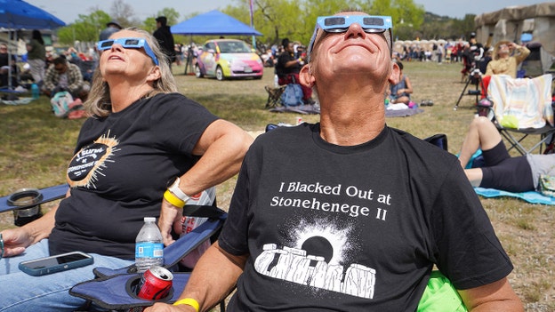 Spectators gather to watch the solar eclipse at 'Stonehenge II'
