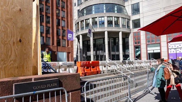 NYU sets up plywood barricades after raucous protests