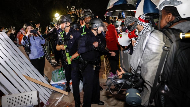 Law enforcement agencies withdraw from UCLA encampment after knocking down barrier to enter