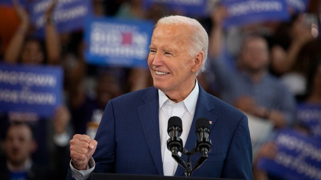 Biden signals he won't drop out at Detroit rally