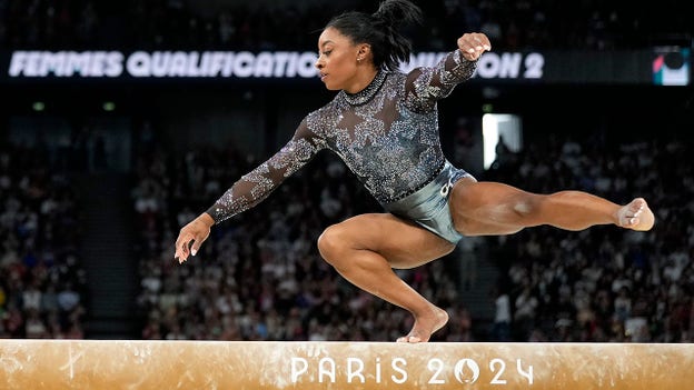 Simone Biles returns to Olympics competition, gets looked at by trainers