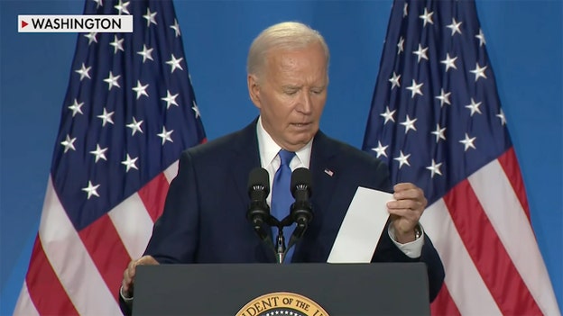 Biden holds up list of reporters he was told to call on during press conference