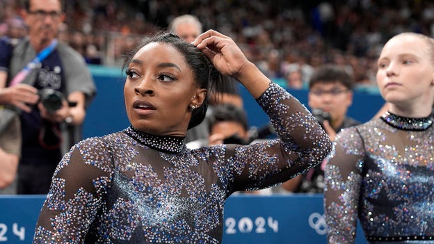 Simone Biles' coach downplays injury concern after gymnast tweaked calf