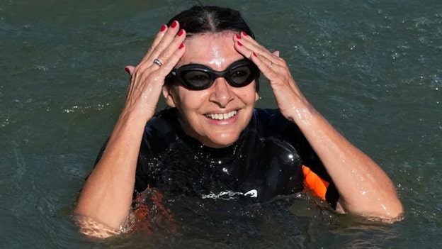 Why did the Paris mayor swim in the Seine river ahead of the Summer Olympics?