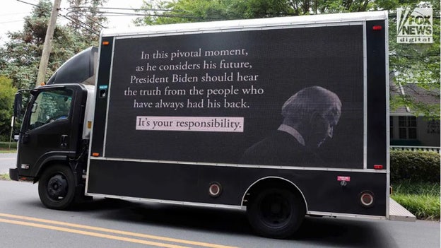 Truck with billboard urging those closest to Biden to help him exit race seen near his beach house