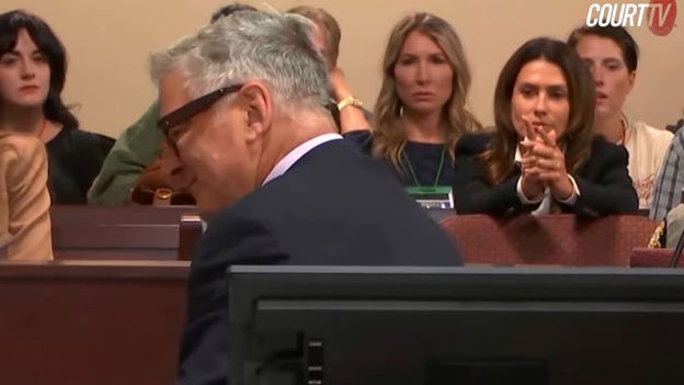 Hilaria Baldwin appears to motion for Alec to pay attention during 'Rust' trial