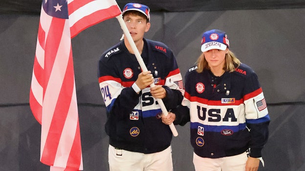 Katie Ledecky, Nick Mead carry American flag into Stade de France