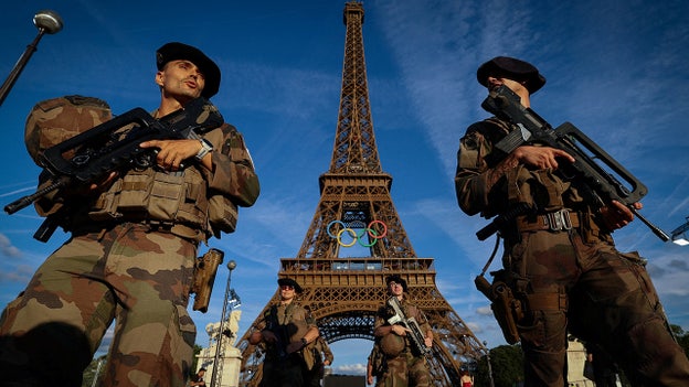 Eiffel Tower evacuated after shirtless man seen climbing tower