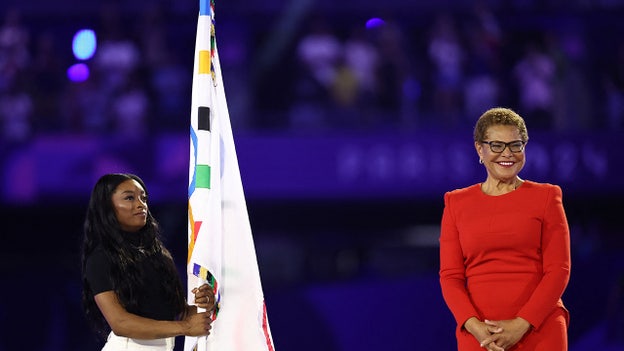 LA Mayor Karen Bass, Simone Biles receive Olympics flag