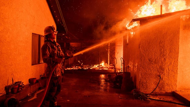 Firefighters brace for strong winds amid progress against wildfires