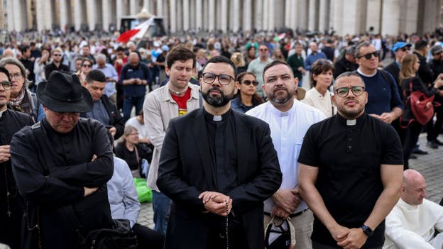 Crowds gather in St. Peters Square eagerly awaiting white smoke from papal vote