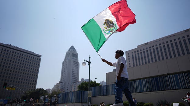 LAPD warns crowd to disperse from area near detention center