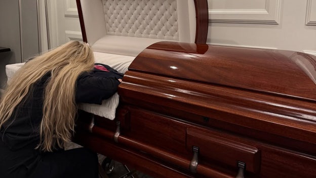 Charlie Kirk’s widow shares photo kneeling before casket of late husband