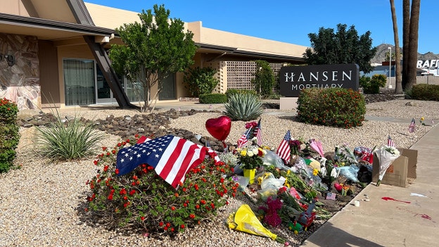 Flags, flowers and tributes honor Charlie Kirk outside Phoenix funeral home
