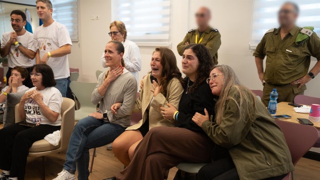 Omri Miran's family watches as he is freed, crosses into Israel
