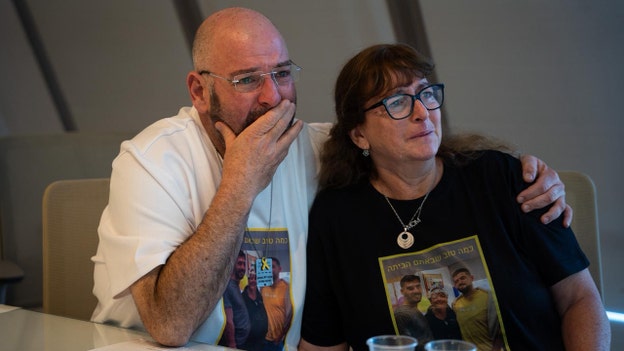 Gali and Ziv Berman's family watches as they are reunited as free men