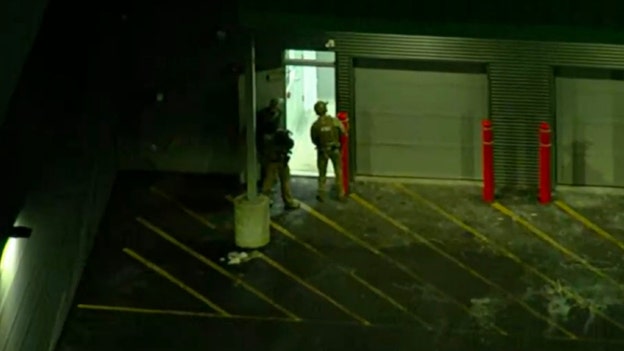Law enforcement enters storage facility in search for Brown University shooting suspect