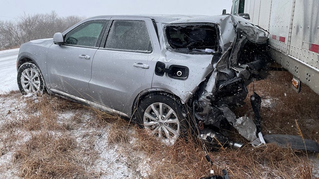 Semi slices trooper's cruiser after sliding on treacherous Kansas interstate