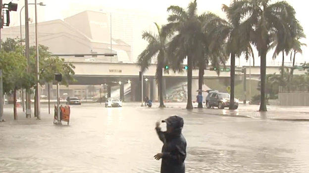 Couple describes swimming away from flooded car in Miami