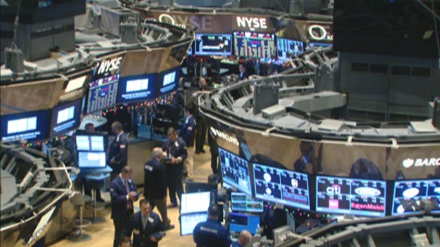Dow reaches highest close of 2015