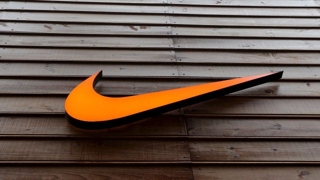 Nike helps Dow stay in positive territory