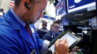 Dow cracks 22,000, Apple hits record high