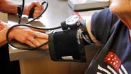 Will new blood pressure guidelines cost Americans?